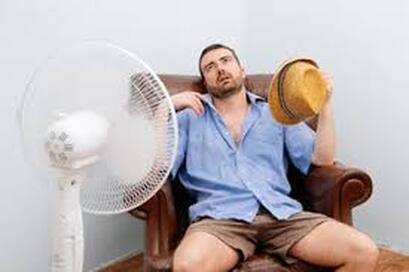 Man hot near fan