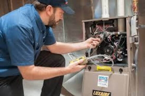 Man fixing furnace 